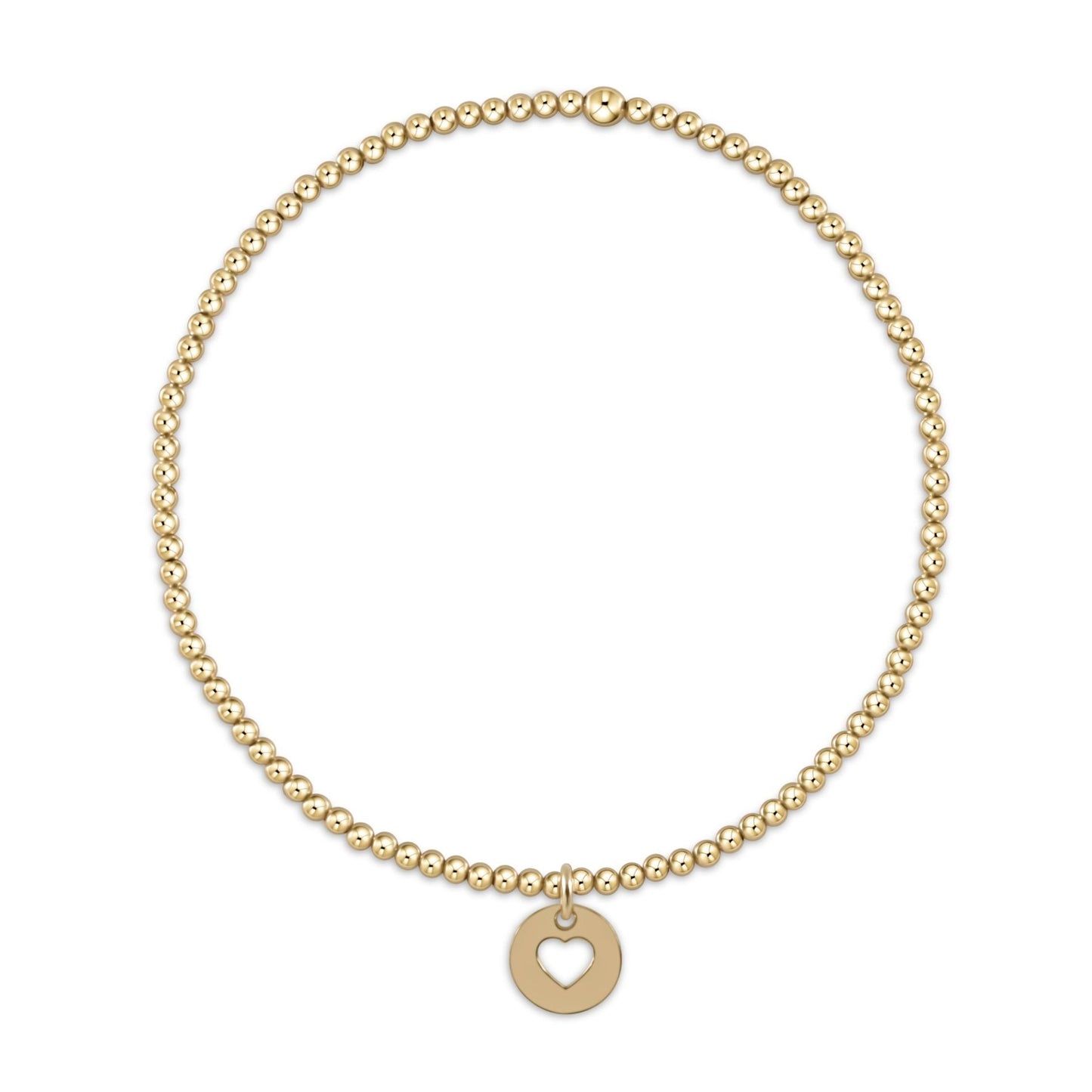 Gold beaded stretch bracelet with small round heart cutout charm pendant