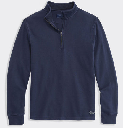 Navy blue quarter-zip pullover with waffle collar and metal zipper