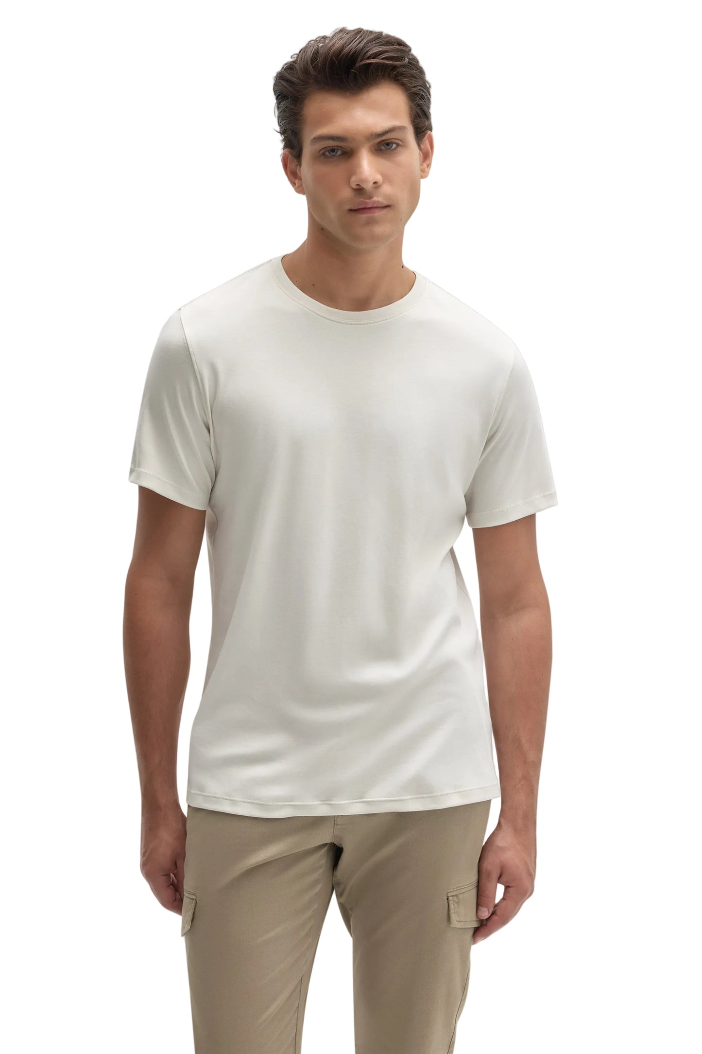 Man wearing ivory cream crew neck short sleeve Pima cotton T-shirt with khaki cargo pants