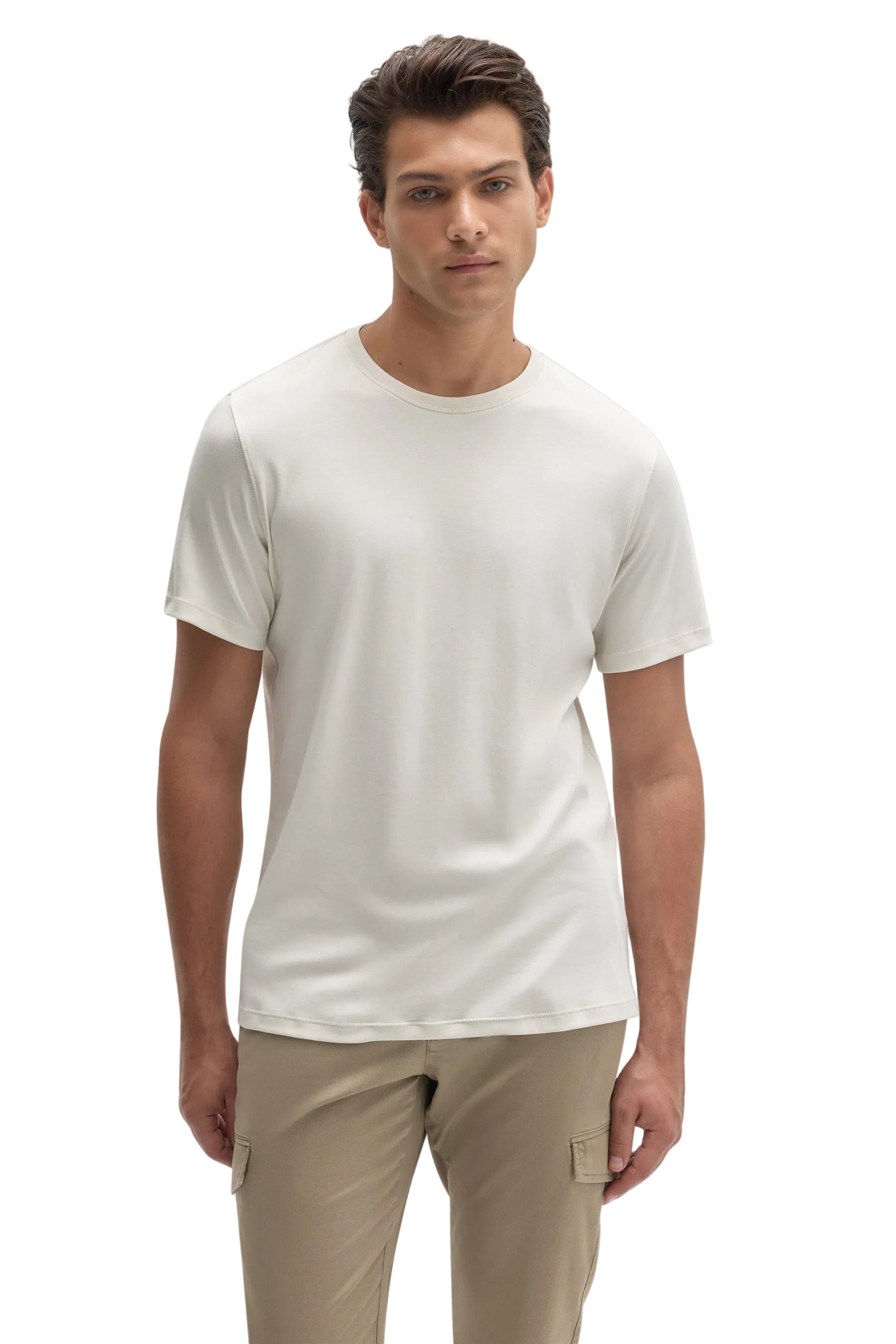 Man wearing ivory cream crew neck short sleeve Pima cotton T-shirt with khaki cargo pants
