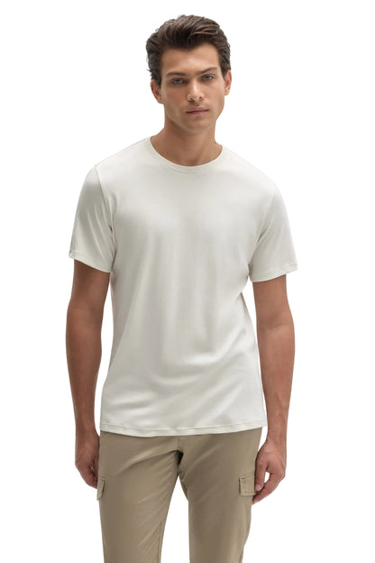 Man wearing ivory cream crew neck short sleeve Pima cotton T-shirt with khaki cargo pants