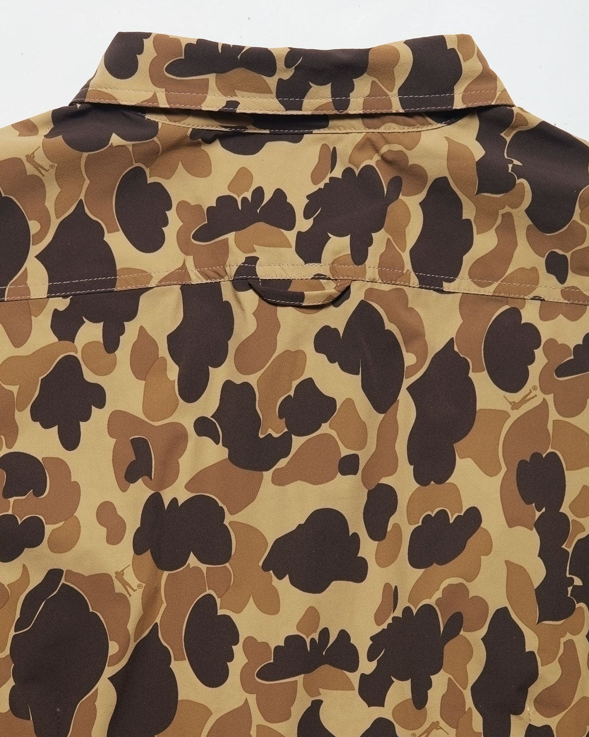 Back view of women's camo field shirt in tan brown and dark brown pattern