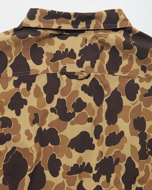 Back view of women's camo field shirt in tan brown and dark brown pattern