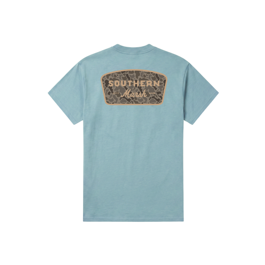 Light blue short sleeve tee with retro camo patch logo on back Southern Marsh