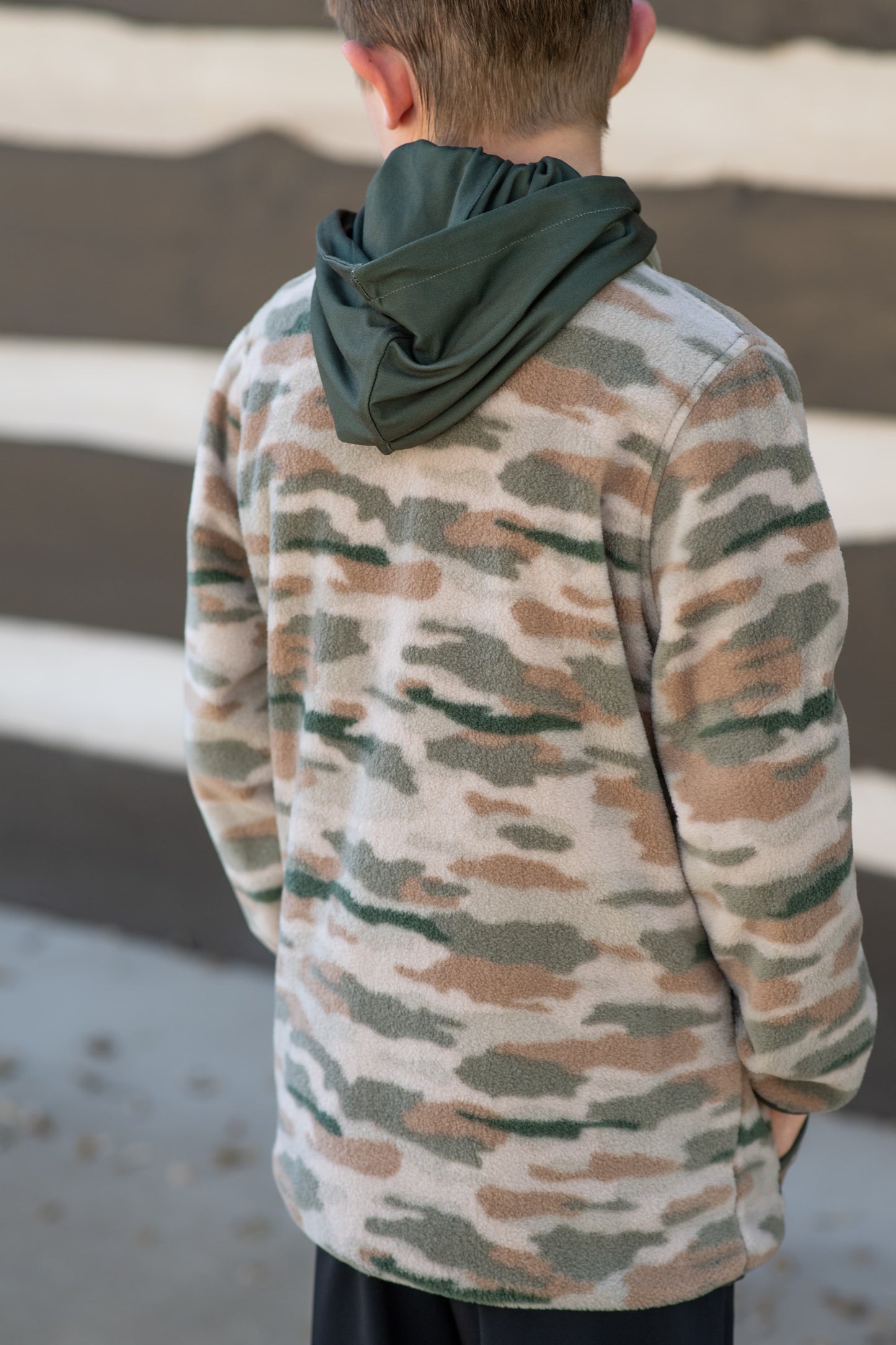 Youth camo sherpa pullover back view with olive green hood, tan brown green pattern