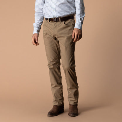 Men's classic fit khaki tan 5-pocket canvas pants with brown leather belt and boots