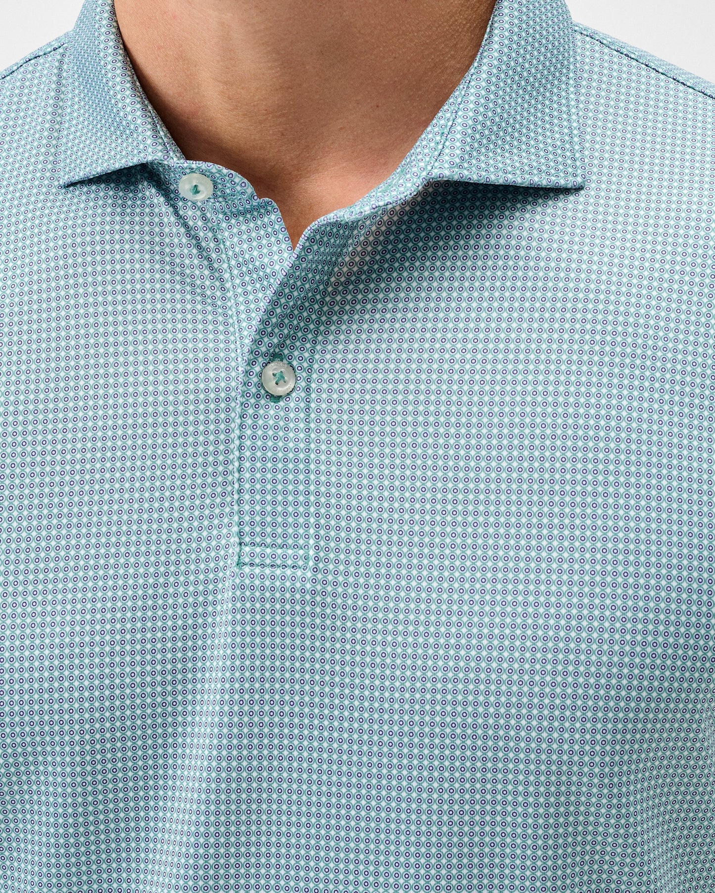 Men's mint green polo shirt with small circular dot print pattern and collar
