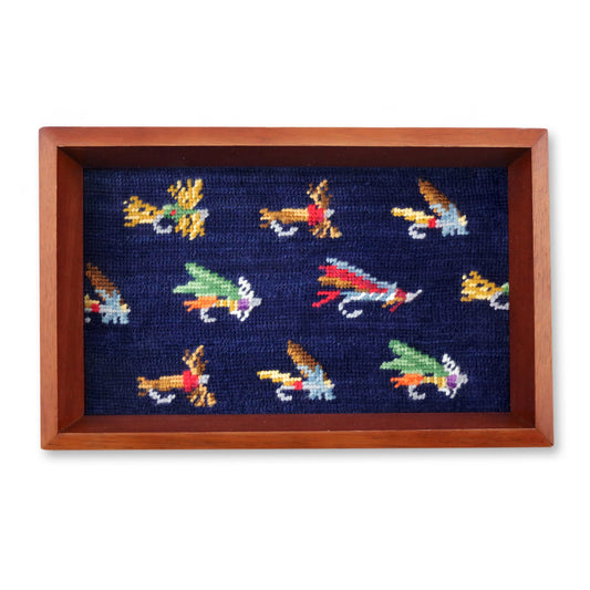 Navy needlepoint valet tray with colorful fly fishing lures in wood frame
