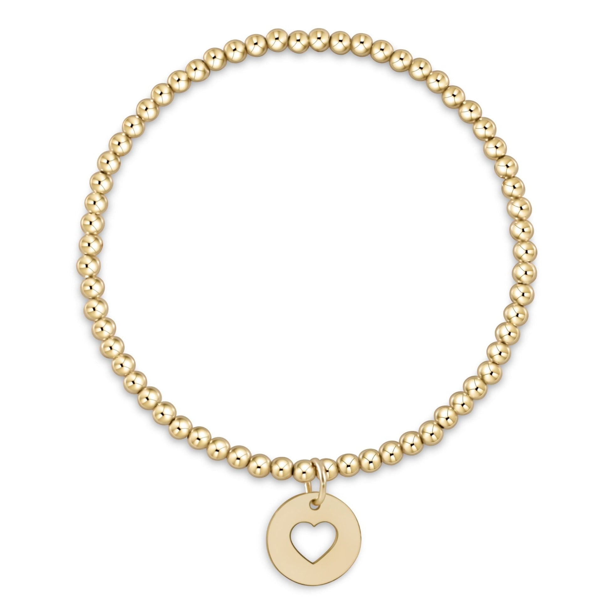 Gold beaded stretch bracelet with circular cutout heart charm pendant