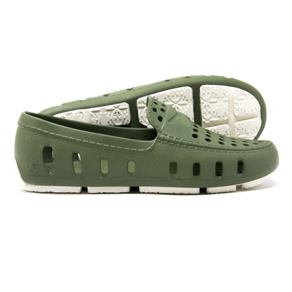 Green and white foam youth loafers with ventilation holes and patterned white outsole