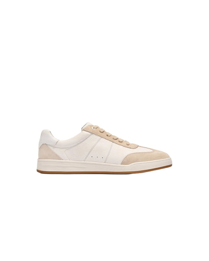 White and tan leather low-top sneaker with suede panels and gum sole