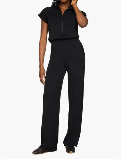 Women's black half-zip jumpsuit with wide-leg pants and short sleeves