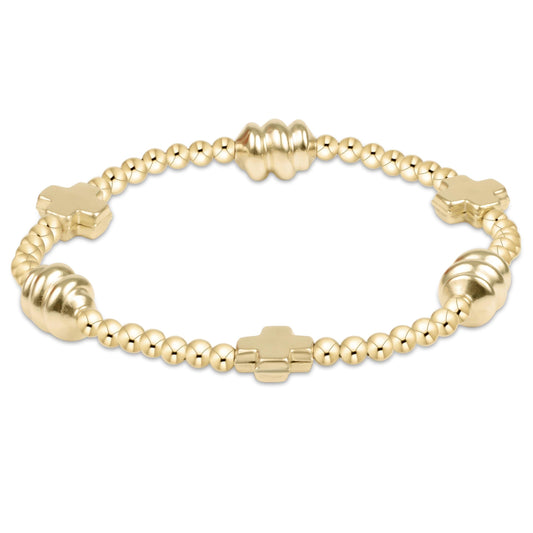 Gold beaded stretch bracelet with cross charms and heart accents in 14kt gold-filled