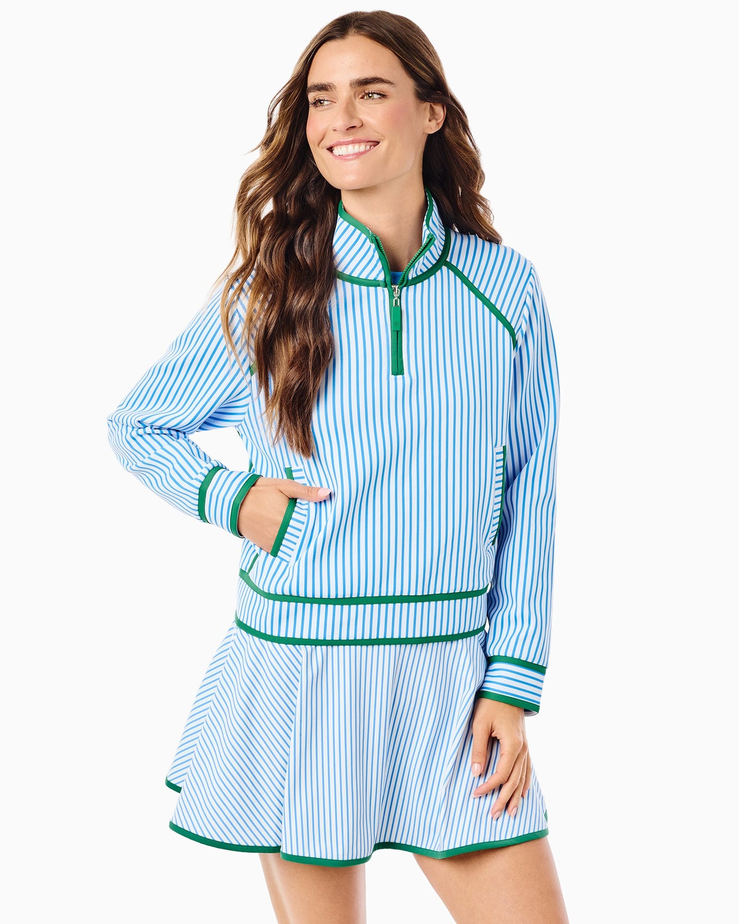 Women's blue and white striped quarter-zip pullover with green trim accents