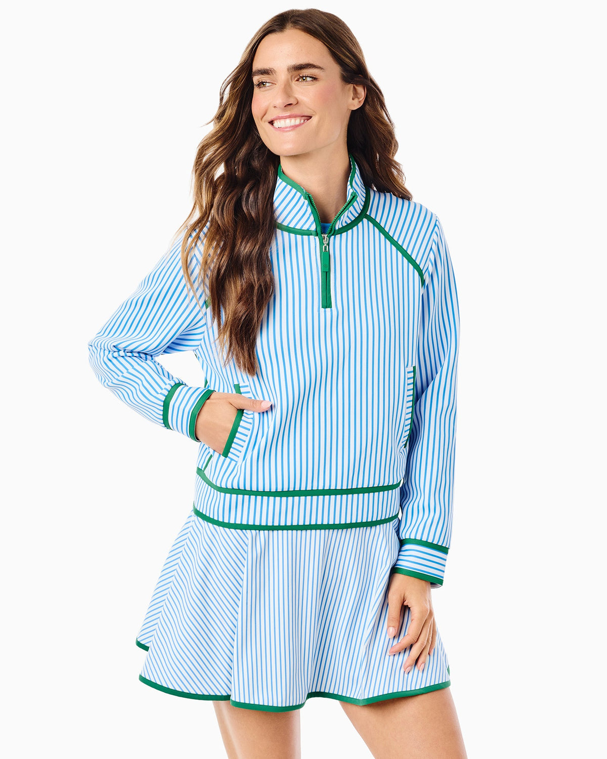 Women's blue and white striped quarter-zip pullover with green trim accents