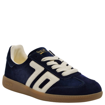 Navy blue velvet low-top sneaker with cream side stripes and gum rubber sole