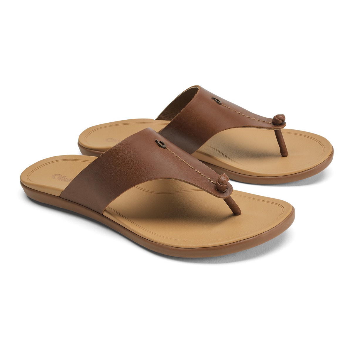 Women's brown leather thong sandals with tan cushioned footbed and rubber outsole