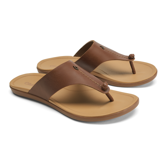 Women's brown leather thong sandals with tan cushioned footbed and rubber outsole