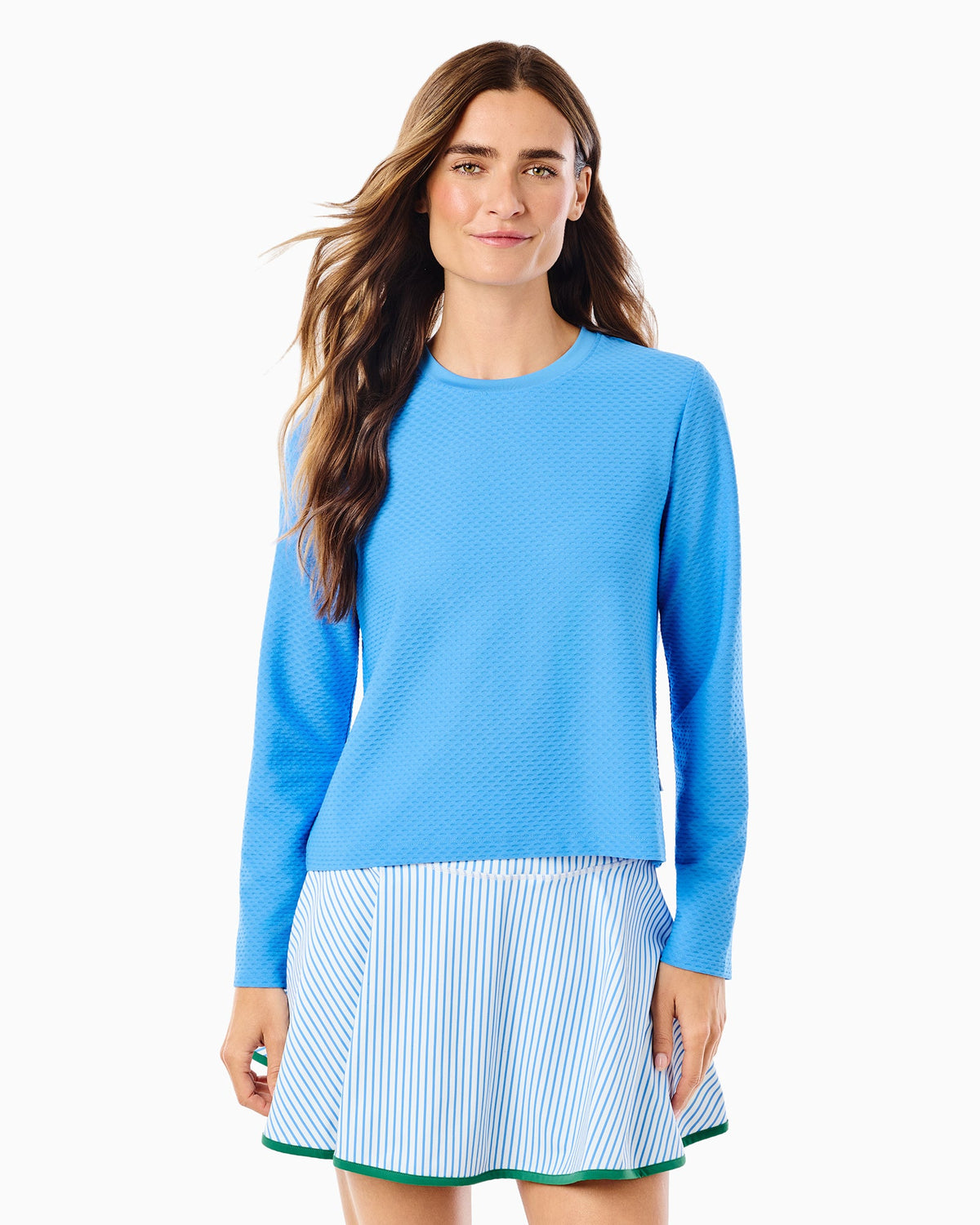 Women's blue textured long sleeve crewneck top with striped skirt